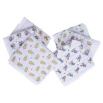 Stack of six white floral cotton napkins neatly folded