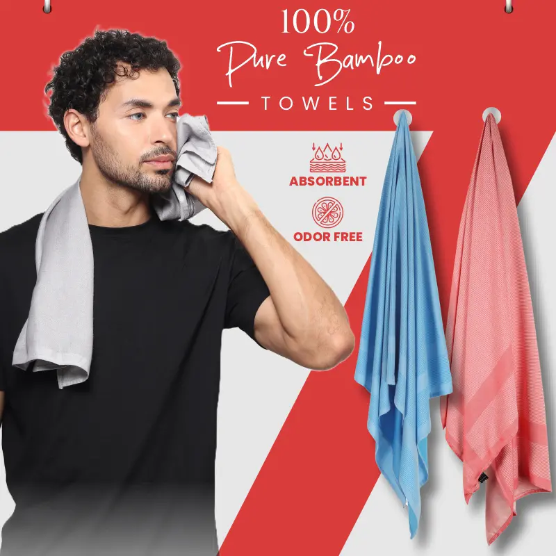 Male model holding ZAHYA bamboo towel with multiple colorful bamboo towels hanging in red and white background