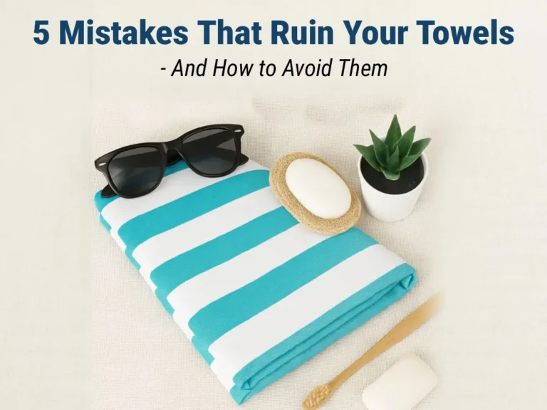A neatly stacked set of soft cotton towels with one looking worn and frayed, symbolizing common mistakes that damage towels.