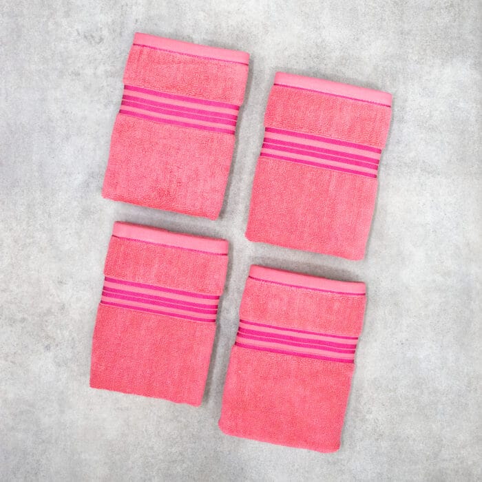 Pack of four 100% pure cotton terry hand towels with soft texture and high absorbency, suitable for bathroom and daily use.