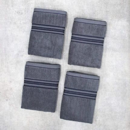 Pack of four 100% pure cotton terry hand towels with soft texture and high absorbency, suitable for bathroom and daily use.