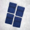 Pack of four 100% pure cotton terry hand towels with soft texture and high absorbency, suitable for bathroom and daily use.