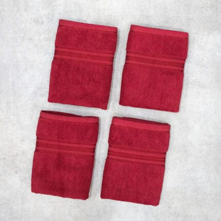 Pack of four 100% pure cotton terry hand towels with soft texture and high absorbency, suitable for bathroom and daily use.