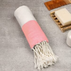 Zahya 100% pure bamboo Turkish towel in peach color, rolled with fringe, lightweight and quick-dry, large size
