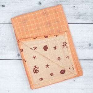 Zahya cotton zero twist bath towel in peach printed checkered pattern, folded, dual layer, highly absorbent and quick-dry, large size