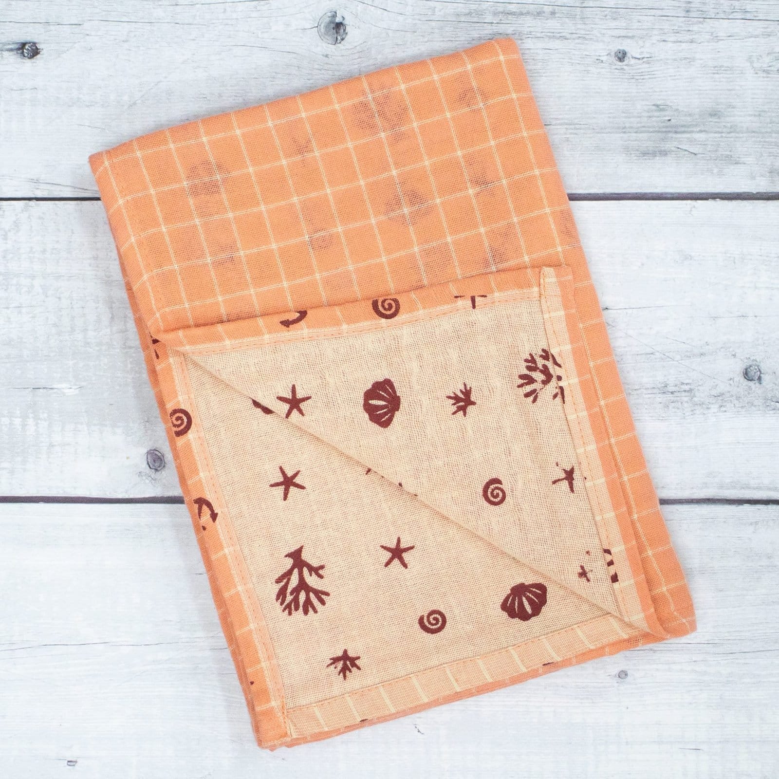 Zahya cotton zero twist bath towel in peach printed checkered pattern, folded, dual layer, highly absorbent and quick-dry, large size