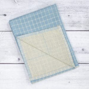 Zahya cotton zero twist bath towel in blue checkered pattern, folded, dual layer, highly absorbent and quick-dry, large size