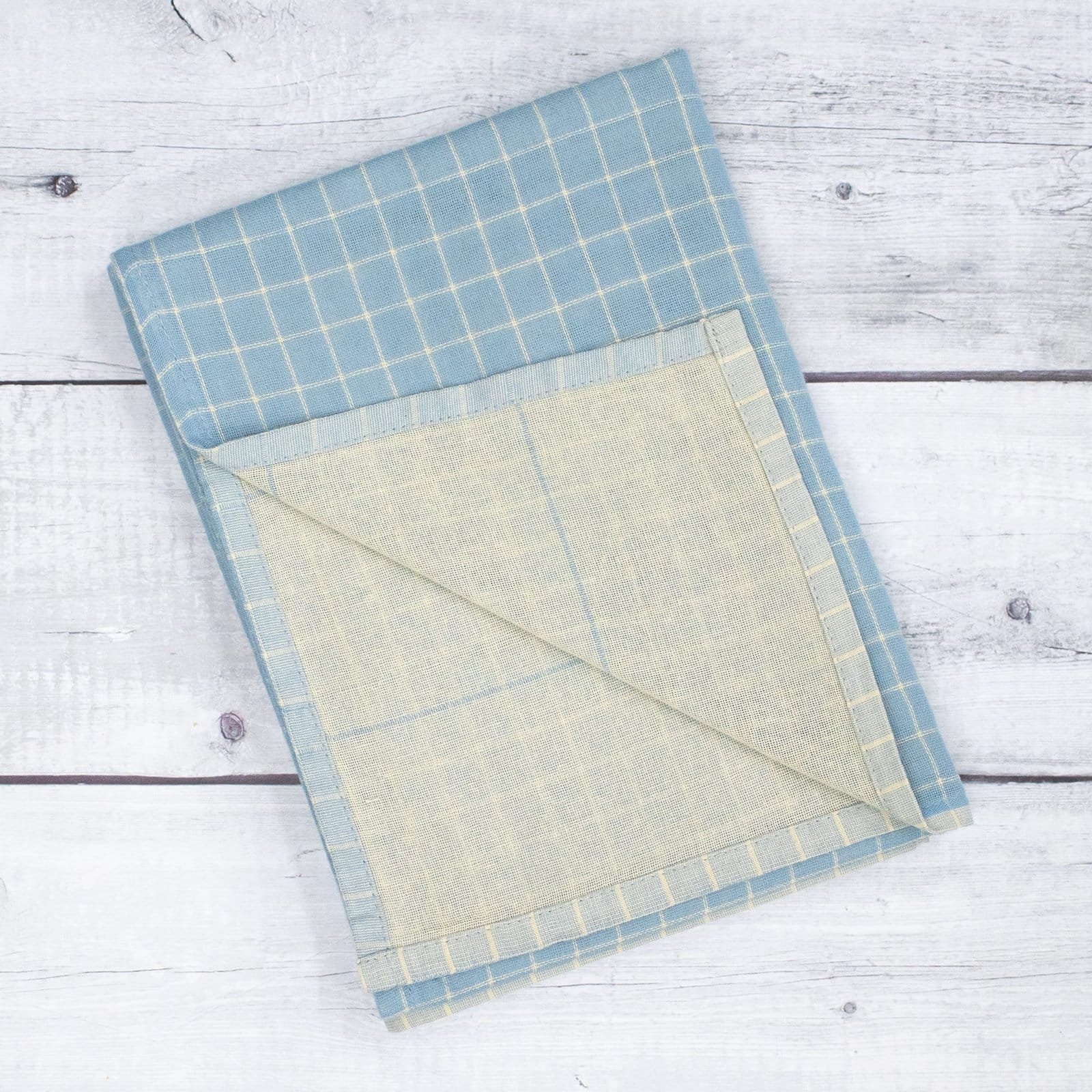 Zahya Zero Twist Bath Towel – Icy Blue Zahya cotton zero twist bath towel in blue checkered pattern, folded, dual layer, highly absorbent and quick-dry, large size
