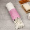 Zahya 100% pure bamboo Turkish towel in pink color, rolled with fringe, lightweight and quick-dry, large size