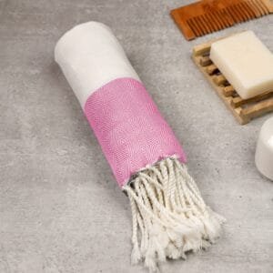 Zahya 100% pure bamboo Turkish towel in pink color, rolled with fringe, lightweight and quick-dry, large size