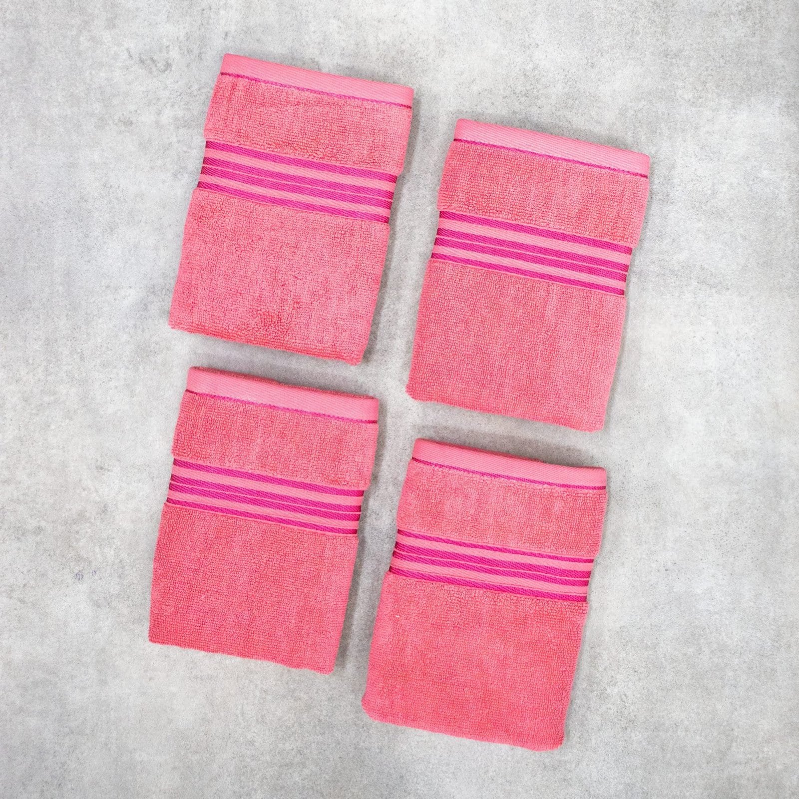 Zahya 100% pure cotton terry hand towels in pink color, pack of 4, folded, soft and highly absorbent, 500 GSM