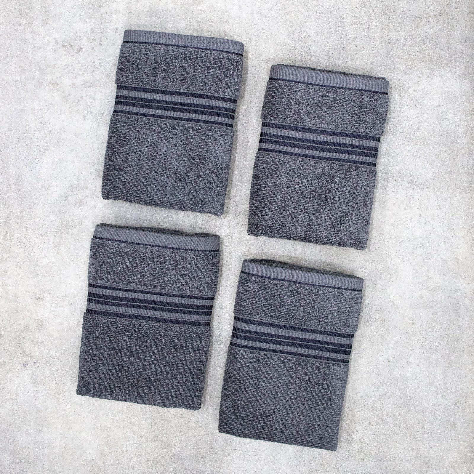 Zahya 100% pure cotton terry hand towels in grey color, pack of 4, folded, soft and highly absorbent, 500 GSM